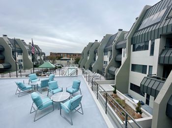 Rooftop terrace with outdoor seating and city views